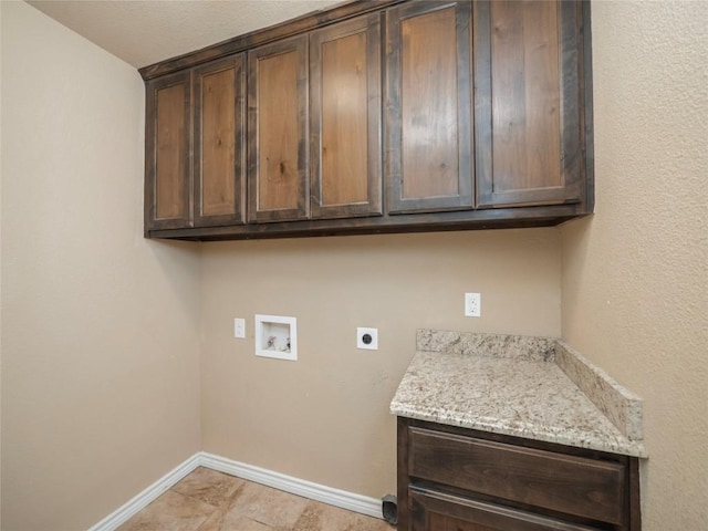 laundry room featuring cabinets, hookup for a washing machine, and electric dryer hookup