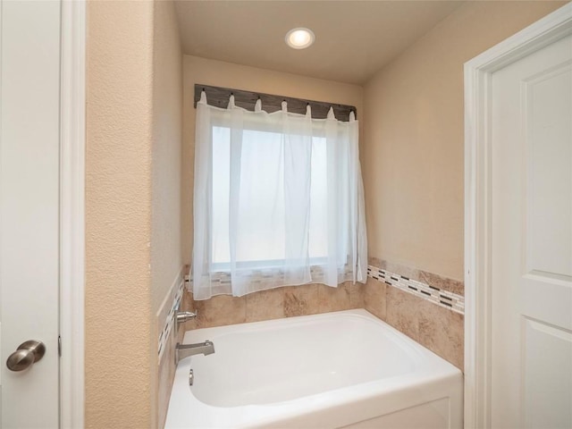 bathroom featuring a tub