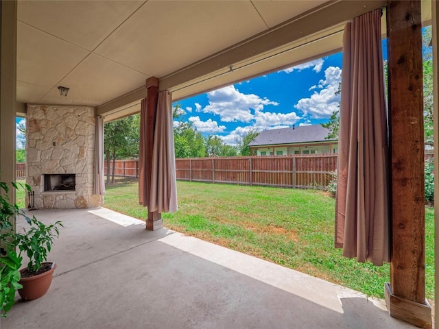 view of patio / terrace with an outdoor stone fireplace