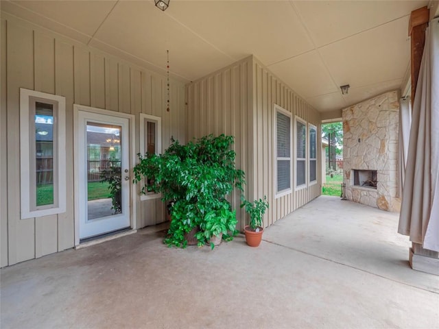 view of patio featuring an outdoor stone fireplace