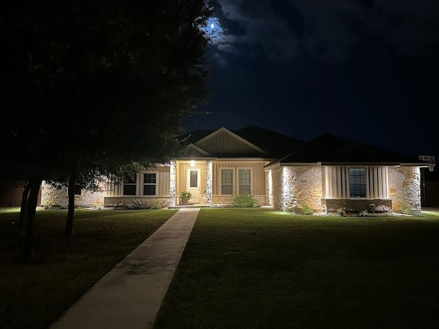 view of front of home with a lawn