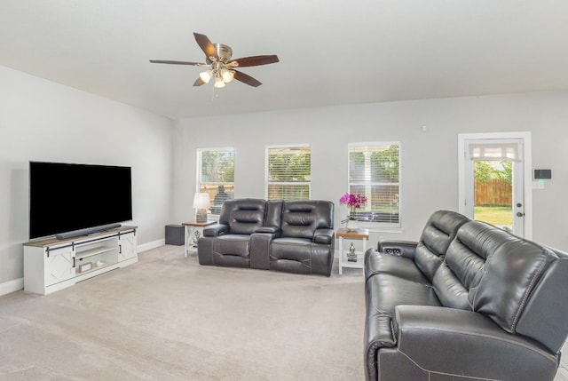 living room featuring light colored carpet and ceiling fan