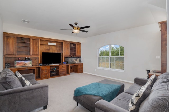 carpeted living room with ceiling fan