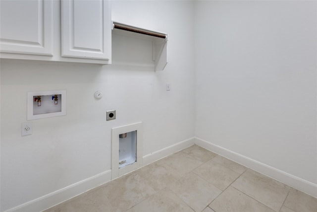 washroom with cabinets, hookup for a washing machine, hookup for an electric dryer, light tile patterned floors, and hookup for a gas dryer