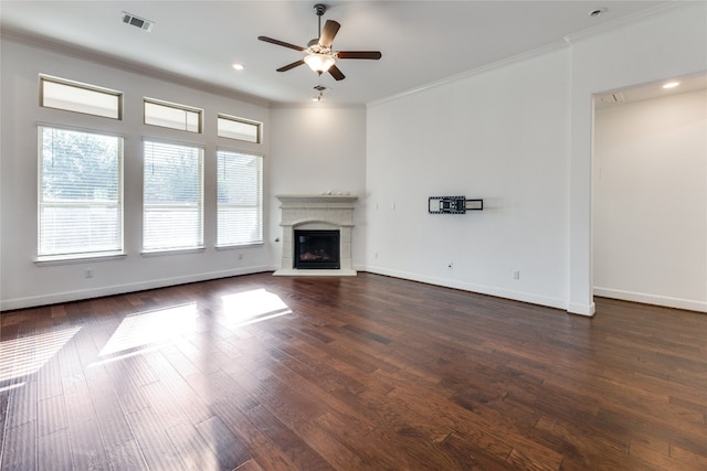 unfurnished living room with ceiling fan, hardwood / wood-style flooring, and crown molding