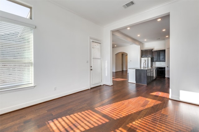 unfurnished living room with dark wood-type flooring