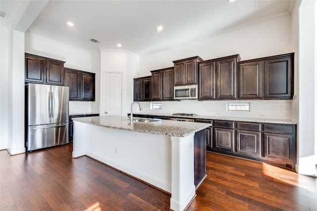 kitchen featuring appliances with stainless steel finishes, decorative backsplash, dark hardwood / wood-style floors, sink, and crown molding