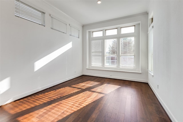 spare room featuring dark hardwood / wood-style floors