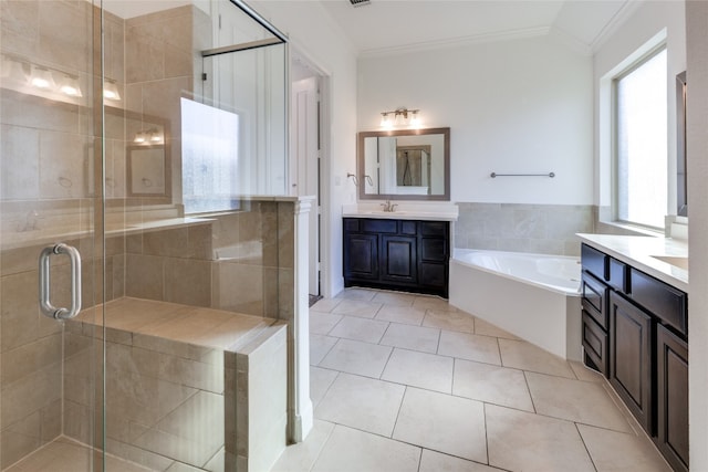 bathroom with crown molding, tile patterned floors, shower with separate bathtub, and vanity