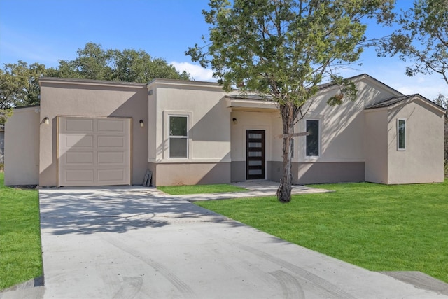 view of front facade featuring a garage and a front yard