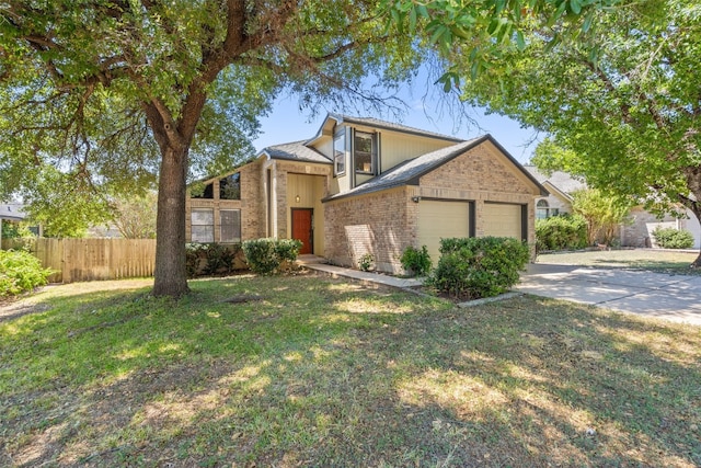 view of front of home with a front yard and a garage