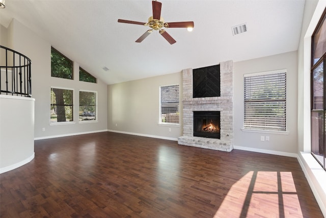 unfurnished living room featuring a fireplace, plenty of natural light, and dark hardwood / wood-style floors