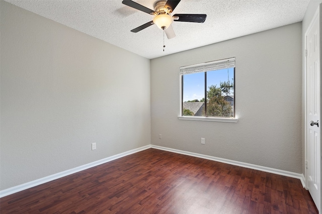 unfurnished room with ceiling fan, a textured ceiling, and dark hardwood / wood-style flooring