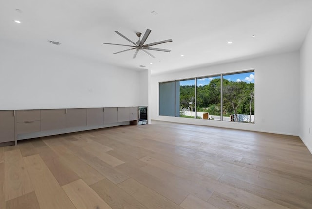 unfurnished living room featuring recessed lighting, visible vents, and light wood finished floors