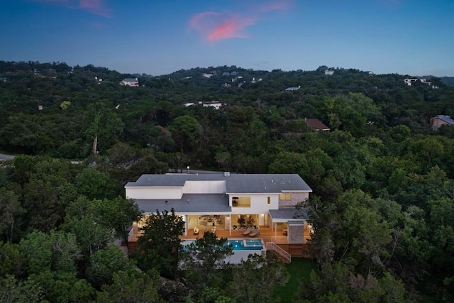 bird's eye view featuring a forest view