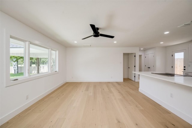 unfurnished living room with recessed lighting, baseboards, visible vents, and light wood finished floors