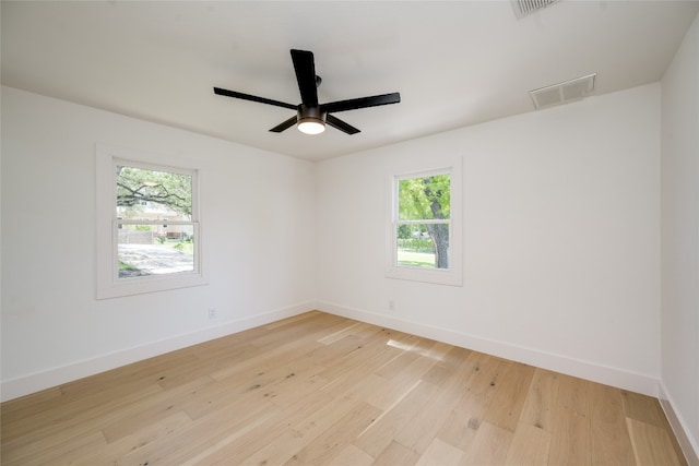 unfurnished room with ceiling fan and light hardwood / wood-style floors