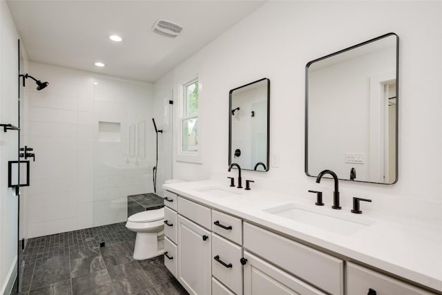 1928 Miles Ave Unit 1, Austin, TX 78745 - bathroom with a shower stall, double vanity, and recessed lighting