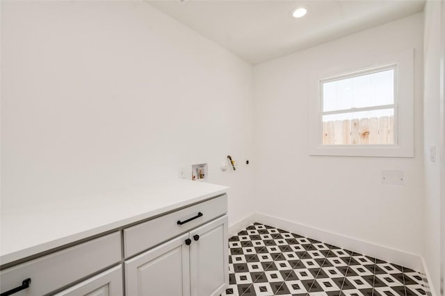 1928 Miles Ave Unit 1, Austin, TX 78745 - laundry area with cabinet space, recessed lighting, tile patterned floors, and hookup for a washing machine