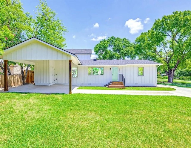 1928 Miles Ave Unit 1, Austin, TX 78745 - view of front facade with fence, board and batten siding, and a front yard
