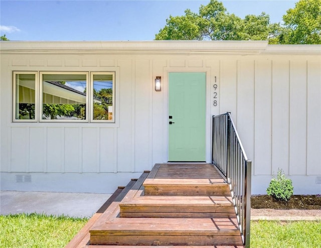 1928 Miles Ave Unit 1, Austin, TX 78745 - entrance to property featuring board and batten siding, crawl space, and visible vents