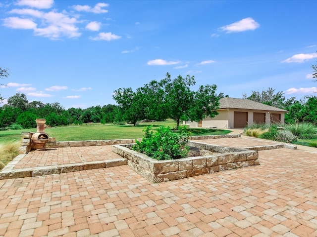 view of patio / terrace with a garage