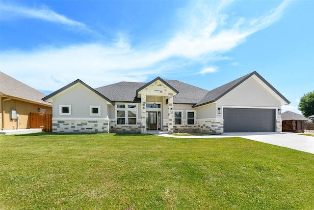 craftsman-style home featuring a front yard and a garage