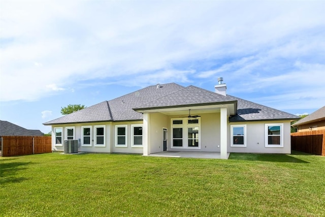 back of property with a patio, ceiling fan, a fenced backyard, cooling unit, and a yard