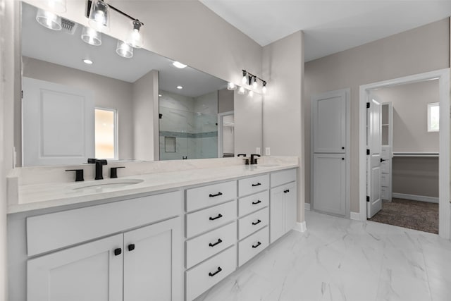 bathroom with tile patterned flooring, double sink vanity, and a shower with shower door