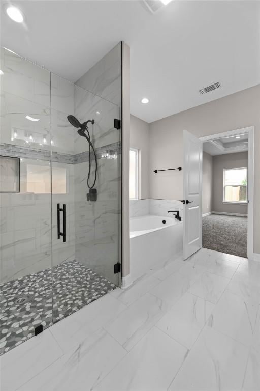 full bath featuring marble finish floor, visible vents, a garden tub, and a stall shower