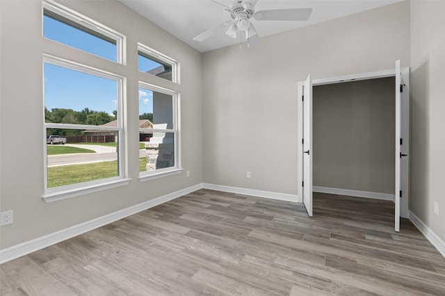 unfurnished bedroom featuring ceiling fan and hardwood / wood-style floors