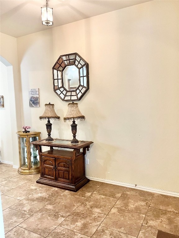 hallway featuring light tile patterned floors