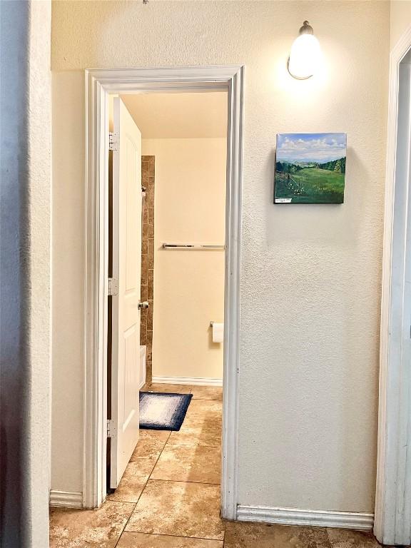 hallway with light tile patterned flooring