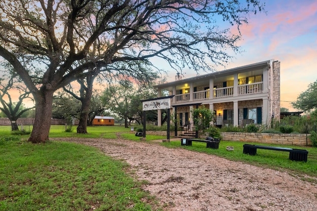 view of home's community with a lawn