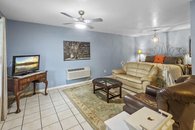living room with light tile patterned floors, ceiling fan, a wall mounted air conditioner, and baseboards