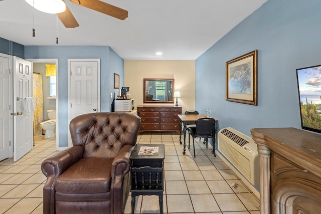 living room with ceiling fan and light tile patterned floors