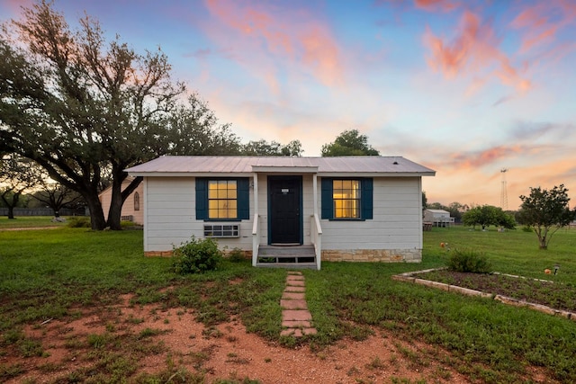 view of front of house with a lawn