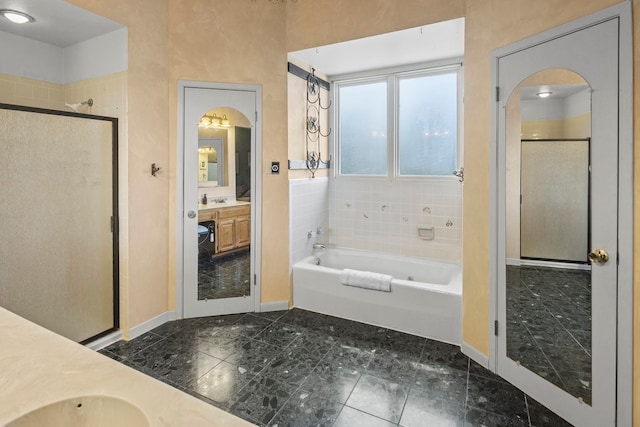 bathroom with tile patterned floors, plus walk in shower, and vanity