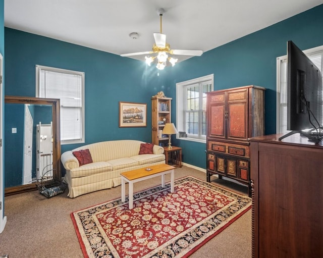 living room with carpet floors and ceiling fan