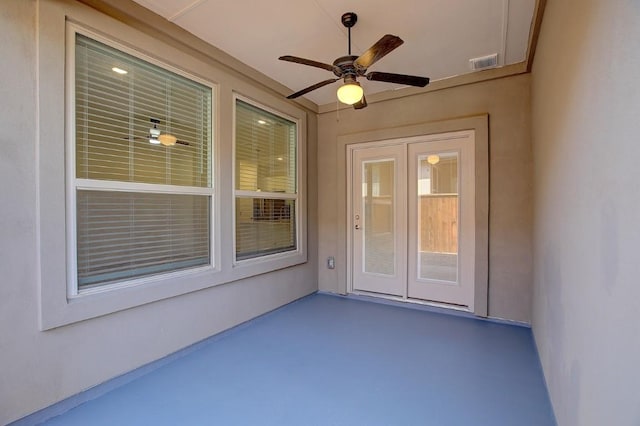 entrance to property featuring ceiling fan