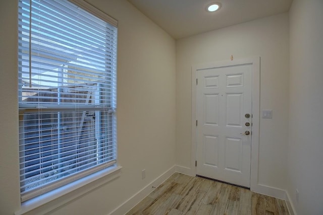 doorway to outside featuring light wood-type flooring