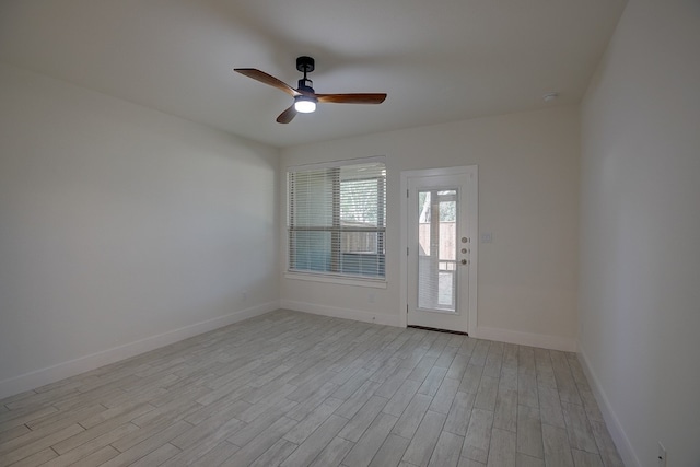 spare room with ceiling fan and light hardwood / wood-style floors