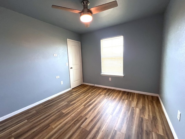 spare room featuring hardwood / wood-style floors and ceiling fan