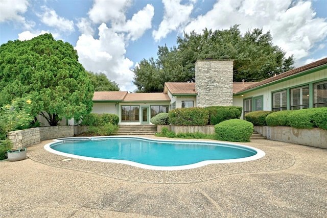 view of swimming pool featuring a patio area