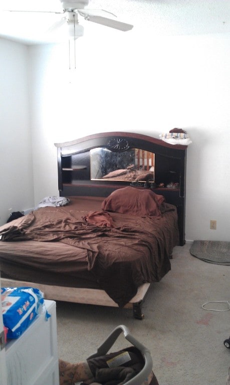 bedroom featuring ceiling fan and carpet floors