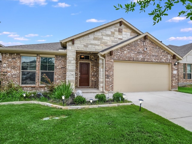 view of front of home with a garage and a front yard