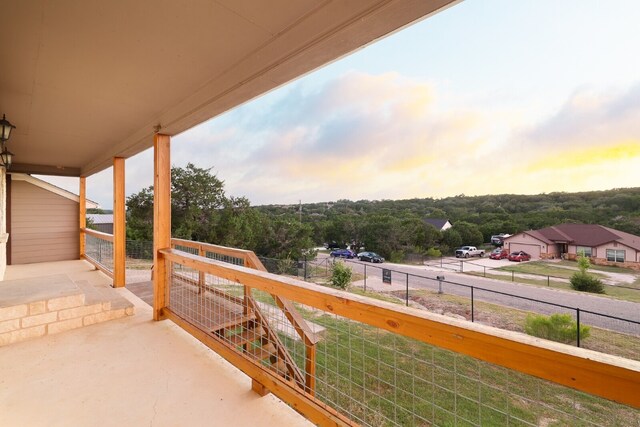 view of balcony at dusk