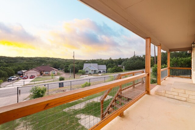 view of balcony at dusk