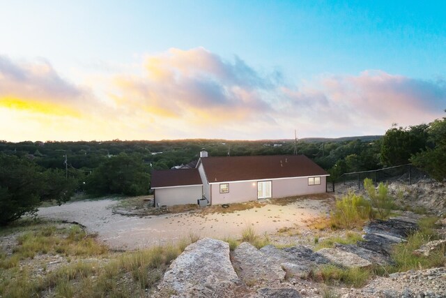 view of property exterior at dusk