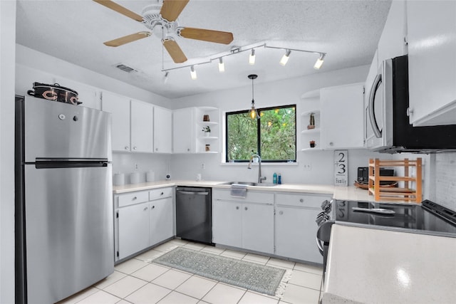 kitchen with appliances with stainless steel finishes, decorative light fixtures, sink, ceiling fan, and light tile patterned flooring